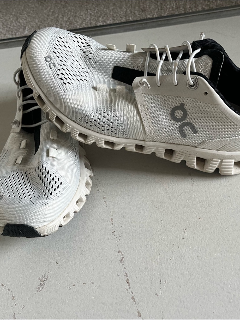 On Running Women’s White and Black Cloud Sneakers
